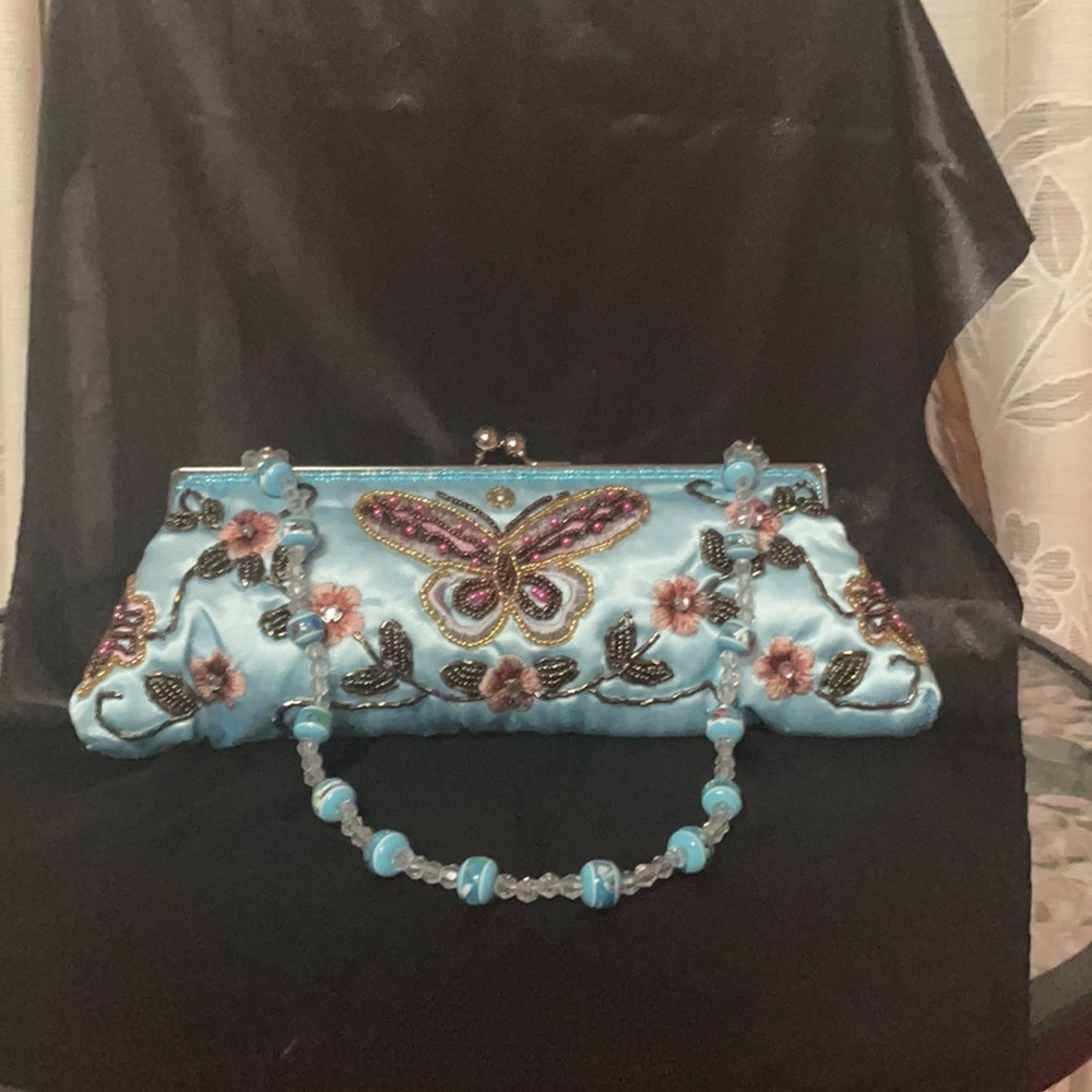 Butterfly clutch with beading.